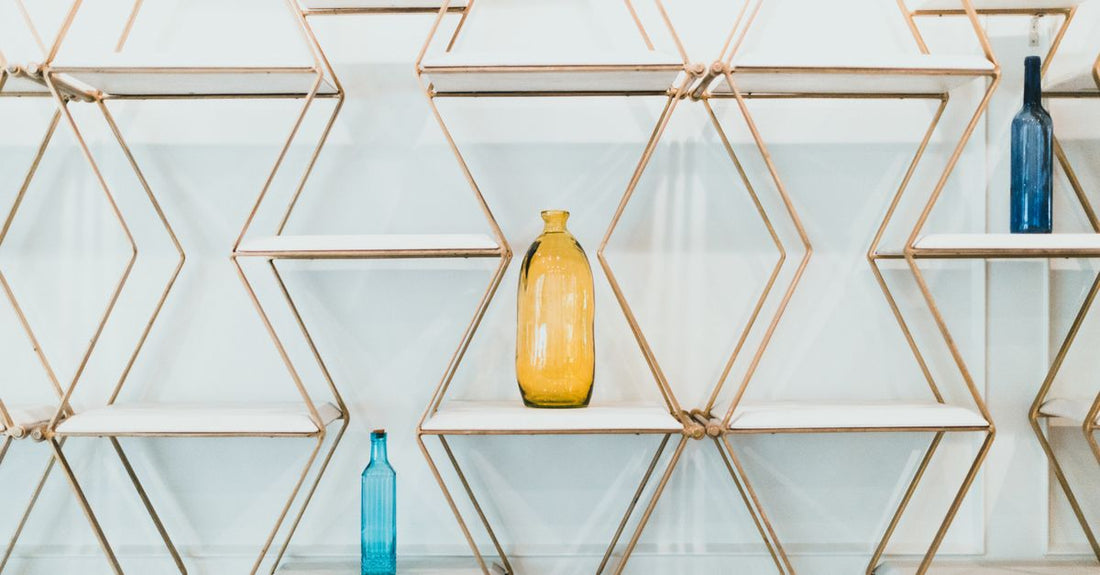 Flatlay of everyday vitamins and supplements bottles on a light surface, showing how to choose everyday vitamins & supplements