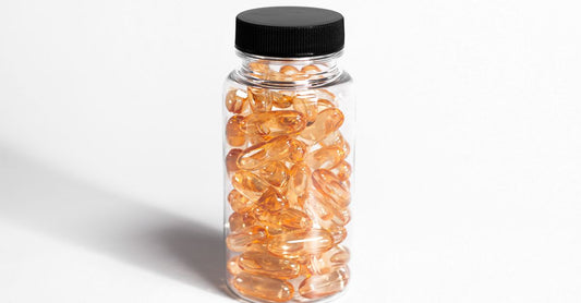 A bottle of Ester-C vitamin C supplement capsules displayed on a clean surface, illustrating what is Ester-C and how it is different from standard vitamin C.