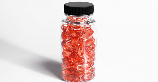 A bottle of vitamin C with rose hips capsules on a clean white background, highlighting natural immune and skin support