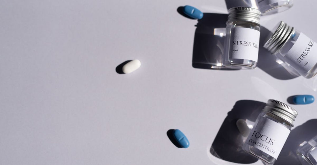 Everyday vitamins and supplements buying guide flatlay with supplement bottles on a clean surface.