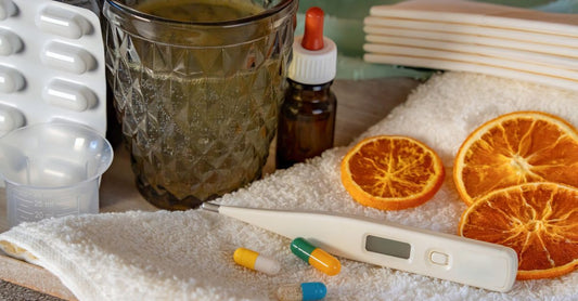 A bottle of best vitamin B12 lozenges on a clean white surface with a few cherry-flavoured tablets scattered nearby, representing fast-absorbing sublingual supplements.