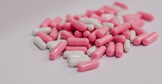 An assortment of everyday vitamin and supplement bottles arranged on a bright surface, representing a buying guide for Australian shoppers.