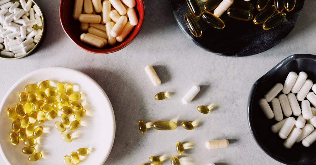 Where to buy everyday vitamins & supplements online: A flatlay of supplement bottles including multivitamins, fish oil and magnesium, representing the value picks available at Vitamins4australia.