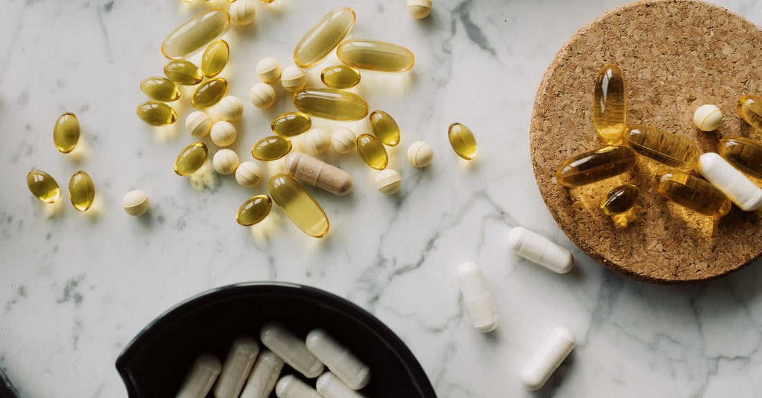 Everyday vitamins and supplements buying guide flatlay showing value supplement bottles on a white background.