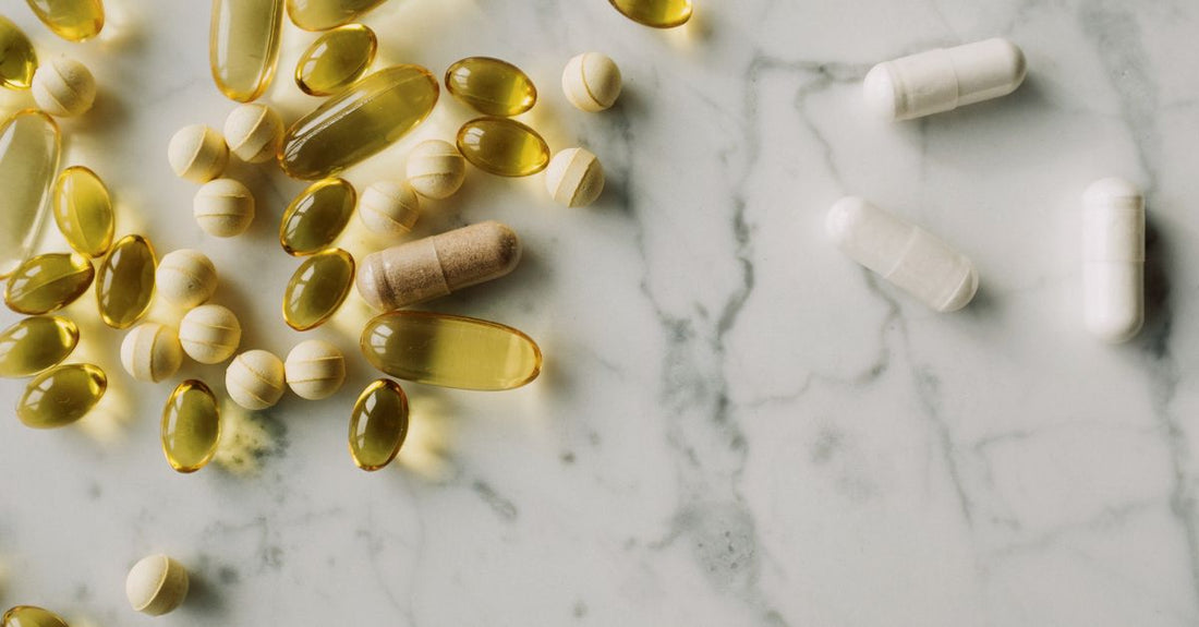 Everyday vitamins and supplements buying guide featuring a selection of supplement bottles neatly arranged on a clean countertop, representing a thoughtful approach to daily nutrition in Australia.