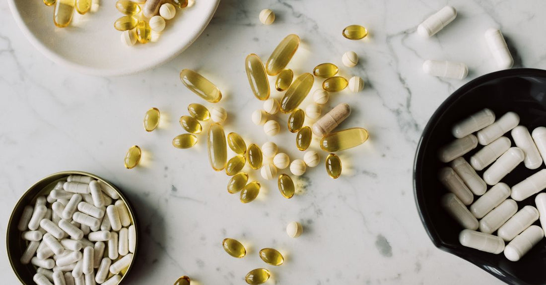 Assorted everyday vitamins and supplements bottles arranged on a clean surface, representing the best everyday vitamins & supplements 2026 available in Australia.
