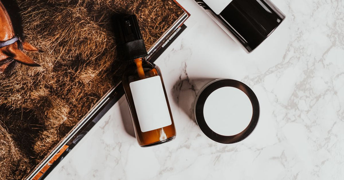An assortment of everyday vitamins and supplement bottles arranged neatly on a marble surface, representing a thoughtful gift-giving selection.