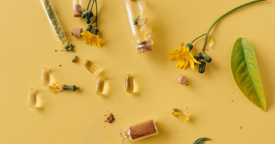 An assortment of everyday vitamin and supplement bottles arranged on a light surface, illustrating how to choose everyday vitamins & supplements for Australian gift buyers.