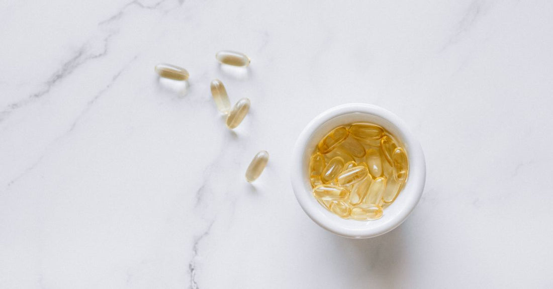Best everyday vitamins & supplements 2026 displayed on a clean white surface with natural light, showcasing pill bottles and packaging.