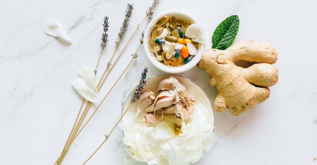 A flatlay of everyday vitamin and supplement bottles on a light surface, representing the best everyday vitamins & supplements 2026 for Australians.