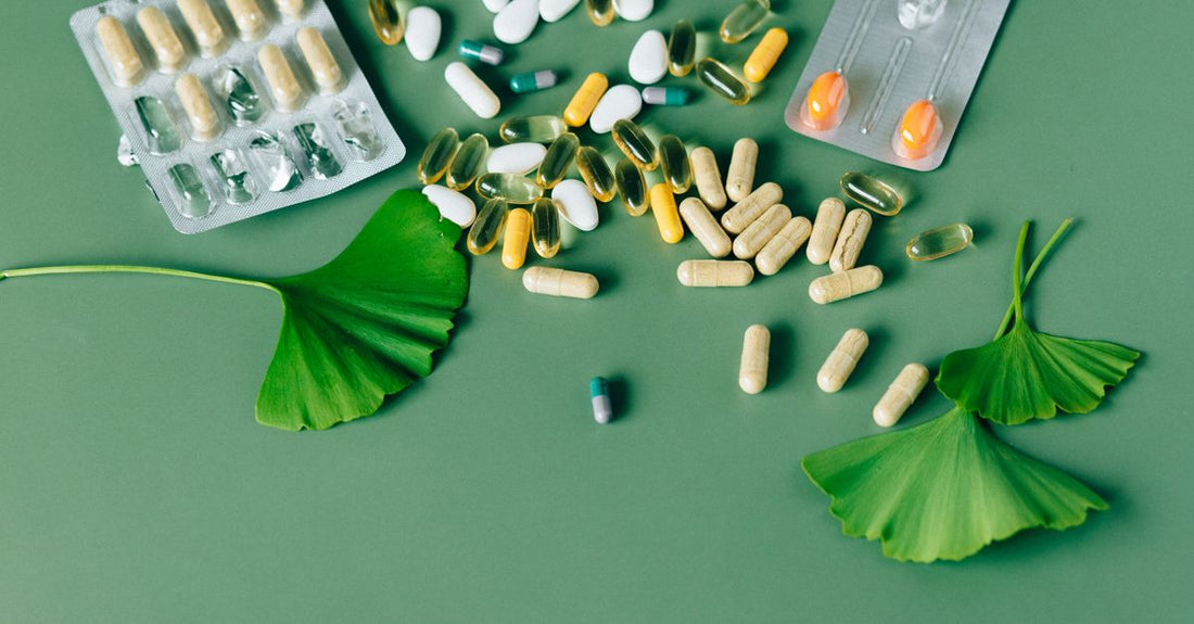 Flat lay of everyday vitamins and supplements bottles on a white background, representing a buying guide.