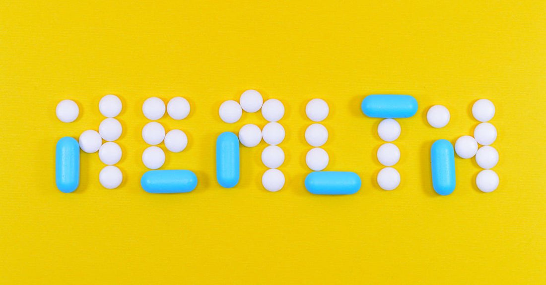 Colourful assortment of everyday vitamins and supplement bottles on a clean white background, representing an everyday vitamins & supplements buying guide.