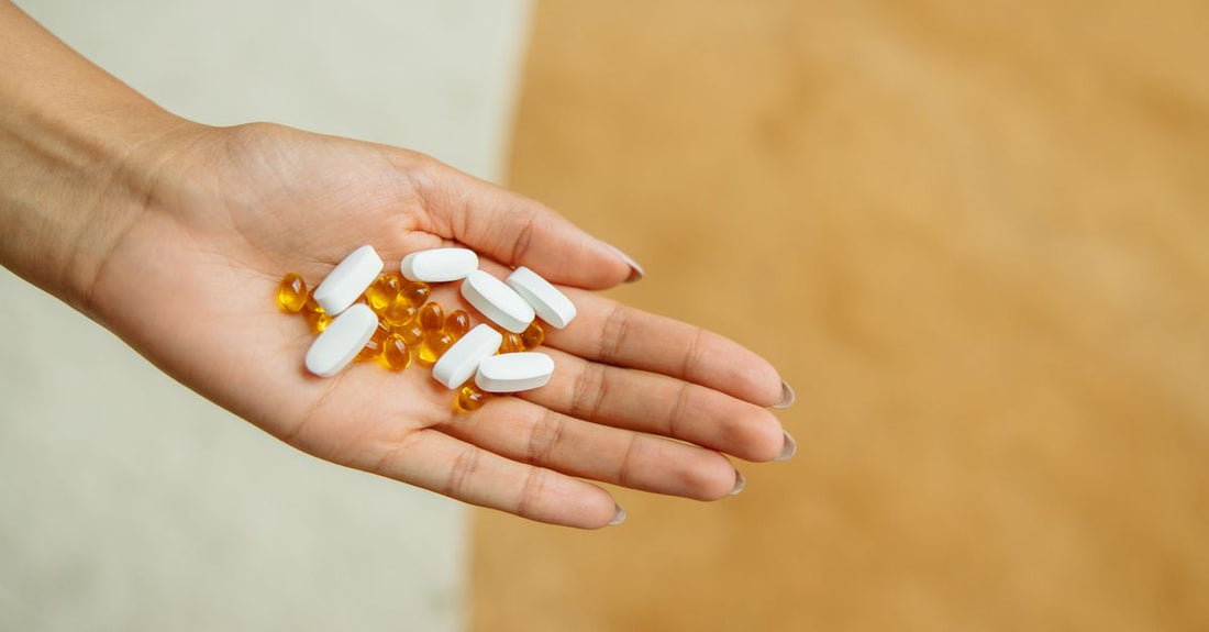 Colourful vitamin and supplement bottles arranged on a white surface, representing a comprehensive everyday vitamins & supplements buying guide for Australian shoppers