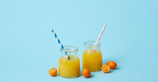 A glass jar of fine white vitamin C powder on a clean surface, representing the best form of vitamin C for absorption.
