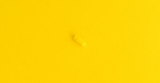 Assorted B vitamin complex capsules and tablets arranged on a clean surface, illustrating how to increase energy with B vitamins.