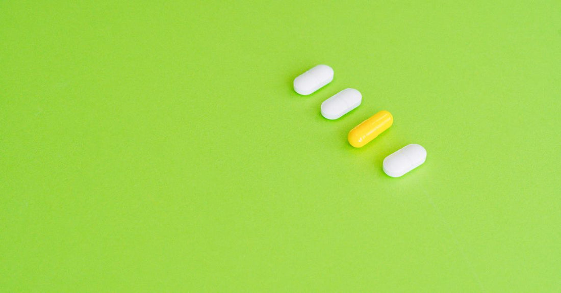 An arrangement of everyday vitamin and supplement bottles on a light background, illustrating a data-driven buying guide.